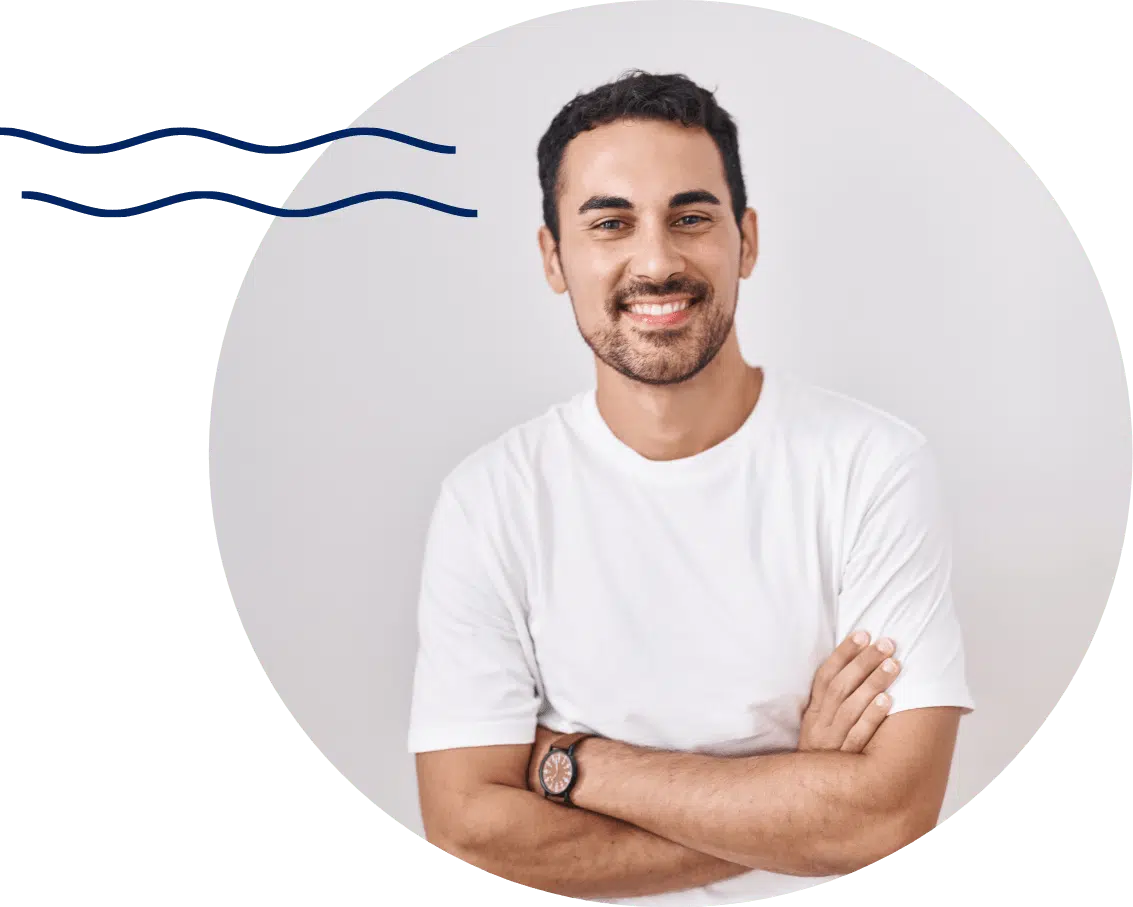 handsome man standing with arms folded